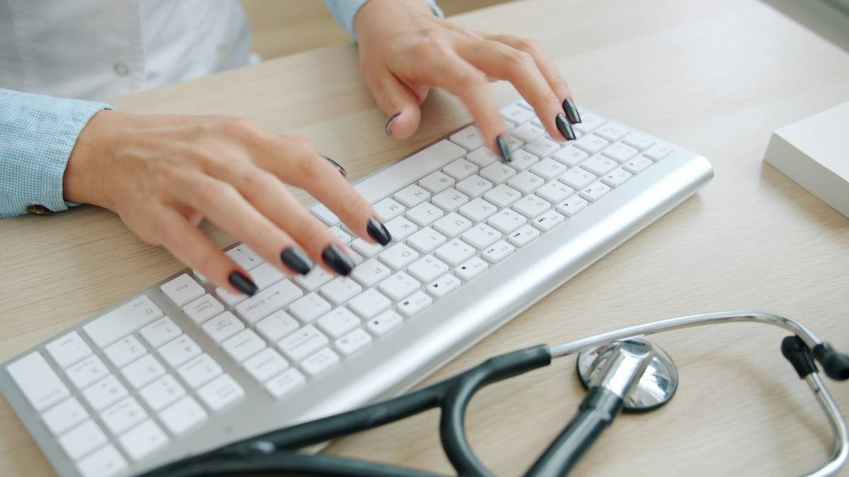 healthcare administration certification test taker reviewing results on computer screen